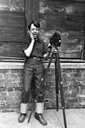 Katz, camera, hand on face