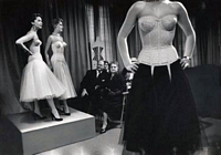 3 models wearing corsets on runway